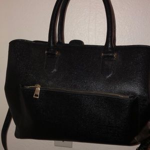 Black purse w/ lavender fluff accessory